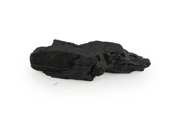 istock Black oak coal isolated on white background. 1366440248