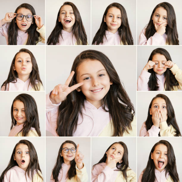 istock Cute little girl making different face expressions, Headshots multiple image 1366440393