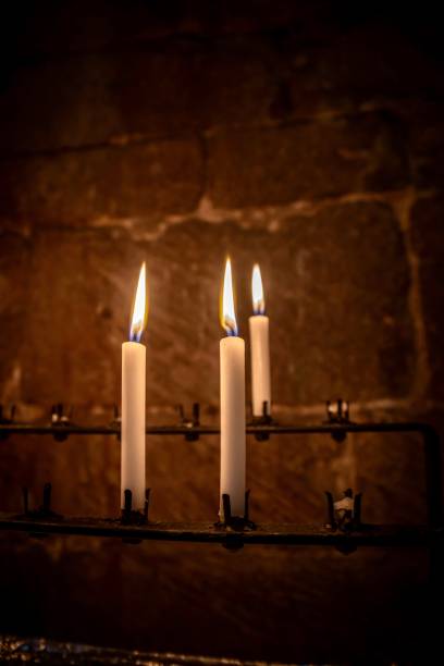 istock Candles on a church candle stand 1366442517