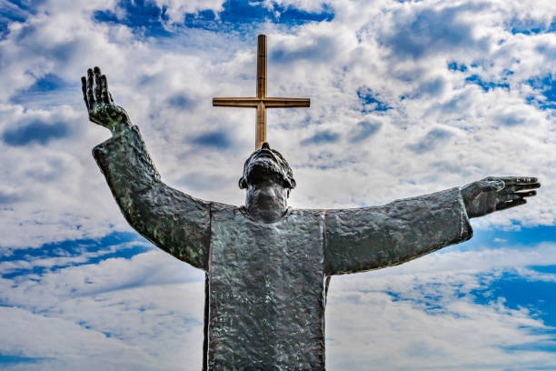 Cruceiro, ancient stone cross backlit at dawn,  near Santiago de Compostela, A Coruña  province, Galicia, Spain.
