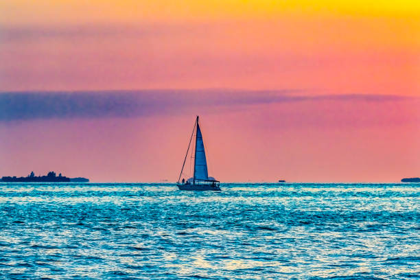 Sunset and boats in the Bahamas at Elbow Cay.