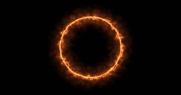 istock Fiery yellow red ring on a black background. Abstract circle of solar flame. A burning ring of fire gradually appeared and a constant burning in a circle 1366444024