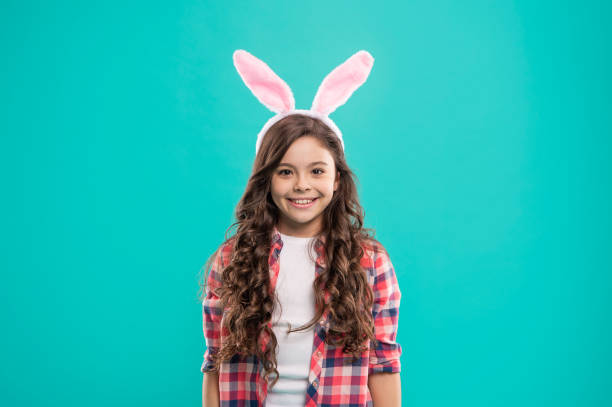 happy child girl in easter bunny ears having fun, happy easter