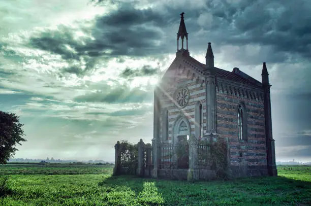Photo of Old abandoned church in countryside in the morning