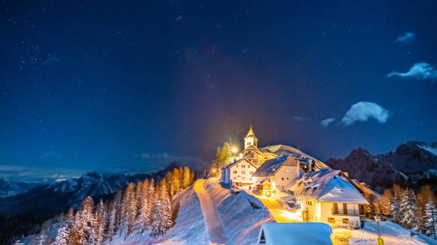 istock Monte lussari night view at winter time 1366444579