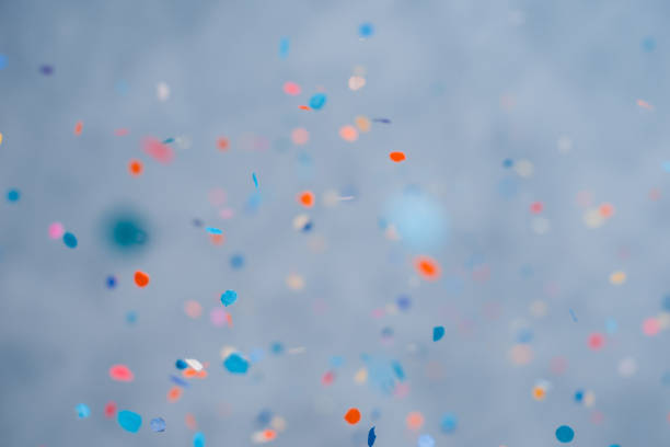 istock Colorful confetti falling on a holiday on a blue background 1366445800