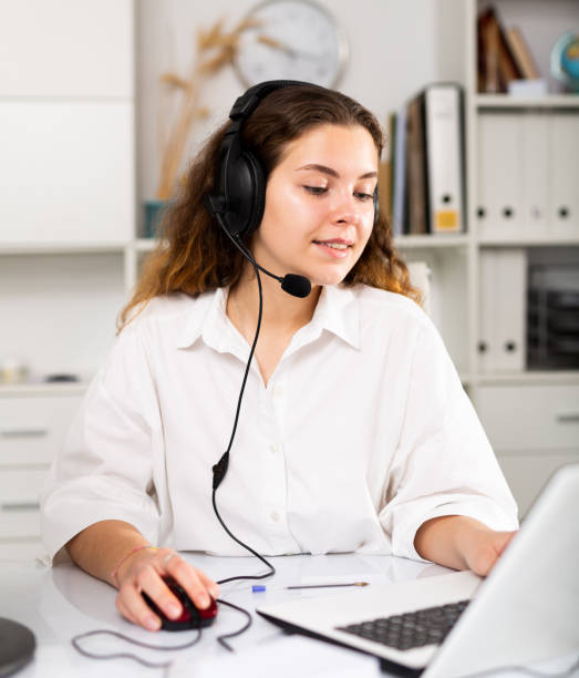 istock Young positive woman customer support phone operator 1366446136