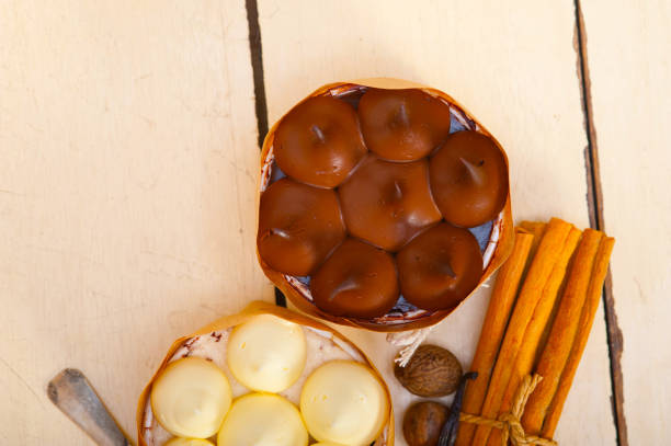 fresh baked chocolate vanilla and spices cream cake dessert over rustic wood table