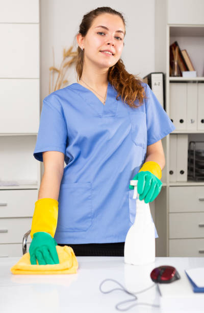 istock Young friendly cleaning woman in work uniform 1366446170