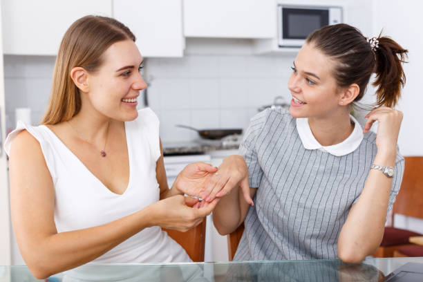 istock Cheerful girl showing her engagement ring 1366447361