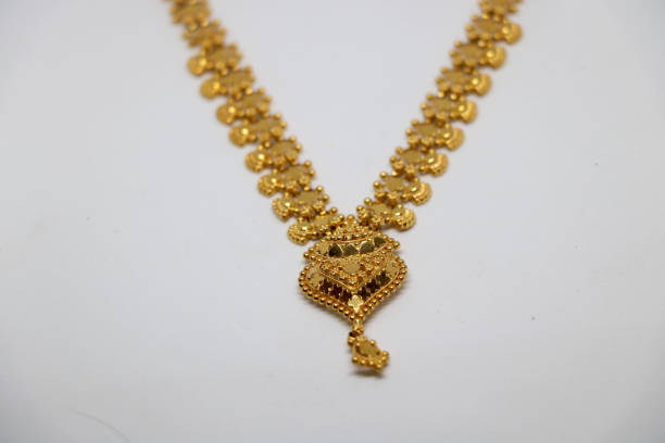 istock Gold necklaces on white background 1366447868