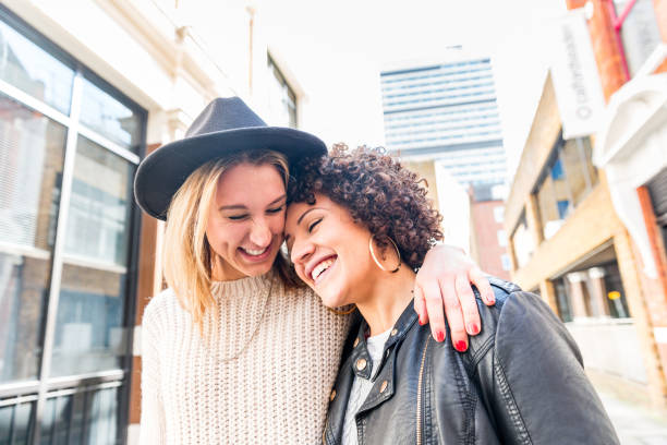 istock Happy lesbian mixed race couple enjoying time out 1366448170