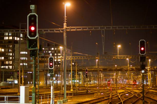 Railroad Switchyard at Night with Signal stock photo