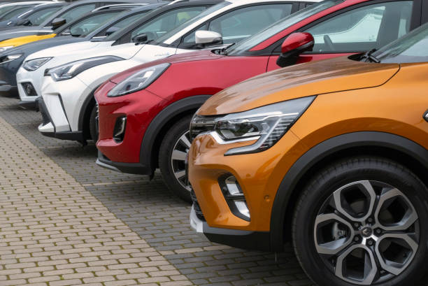 crossover vehicles on a parking - automobile industry metal industry in a row gear imagens e fotografias de stock