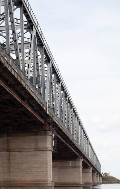istock Metal bridge over wide river 1366458698