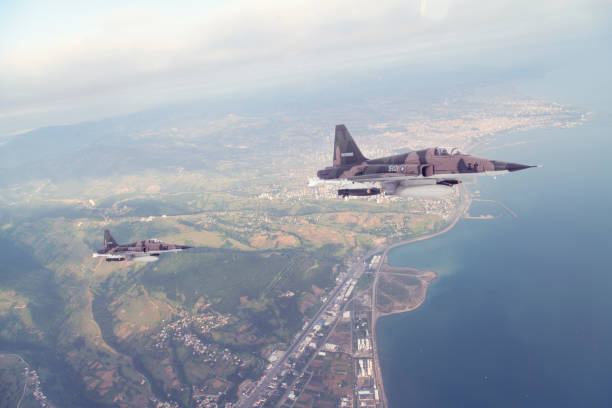 istock Jet fighters flying over city. 1366460033