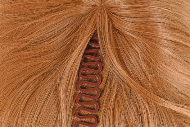 istock French hair braiding tool on blond hair 1366460493