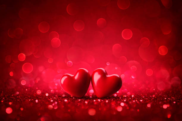 Couple Hearts On Shiny Glitter Background With Bokeh Abstract Lights