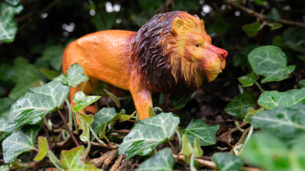 istock Rubber lion toy in nature. 1366461382