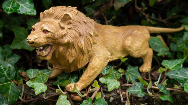 istock Brown Plastic Toy Lion outside. 1366461384