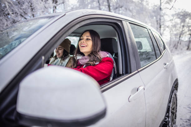 istock Young women on a winter road trip 1366463184