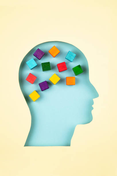 istock Human head in paper cut style with multicolored cubes 1366463188