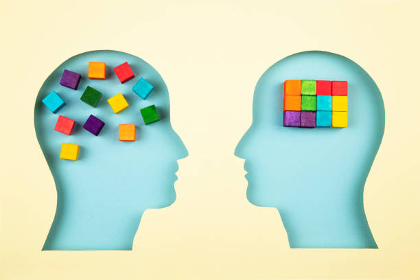 istock Human heads in paper cut style with multicolored cubes 1366463213