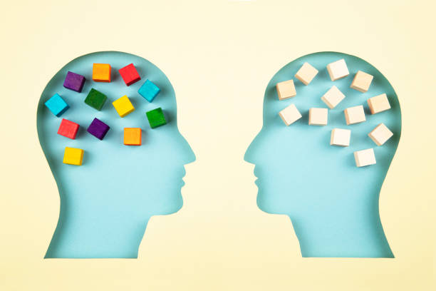 istock Human heads in paper cut style with multicolored cubes 1366463246