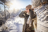 Young woman enjoys snowy winter day