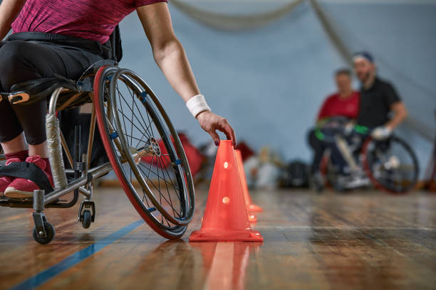 Competitions of the people in wheelchair at the sport holl stock photo