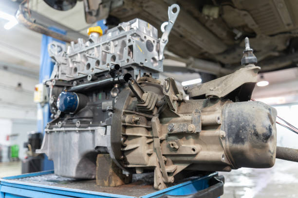 istock a gearbox mounted on a car engine stands on a workbench, under the car, close-up. selective focus 1366464987