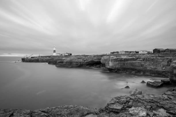 Black and white photo of Portland Bill lighthouse in Dorset at dusk