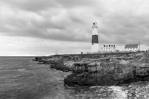 Black and white photo of Portland Bill lighthouse in Dorset at dusk