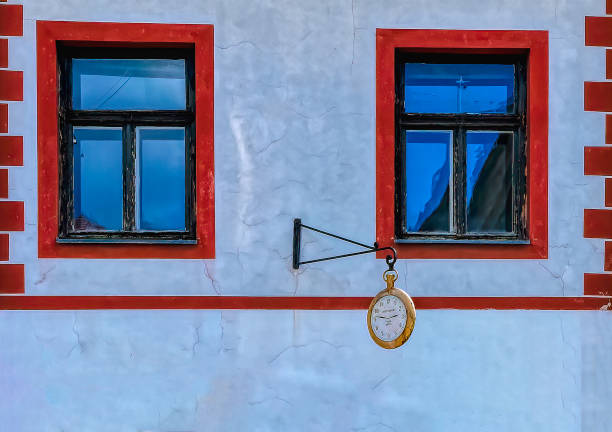 Wall clock at old city house in Maribor, Slovenia.