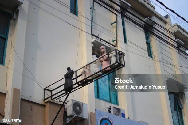 A Group Of Old Used Mannequins Is Displayed On A Storefront In Bandung City Stock Photo - Download Image Now