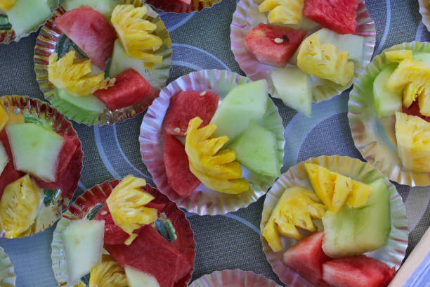 istock Different fresh fruits slices on small plates on a wedding buffet table 1366474075