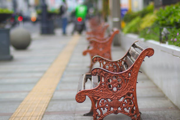 istock Antique Bench with blurred background on a sidewalk in Bandung City 1366474334