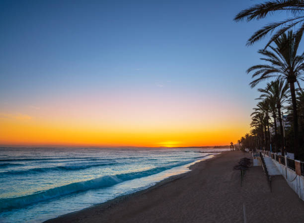 Marbella sunset beach in Playa de la Fontanilla in Malaga province of Spain