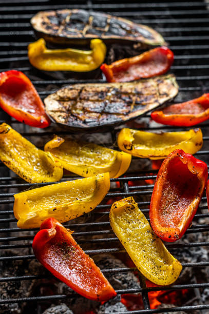 istock Grilled vegetables on barbecue, outdoor BBQ grill with fire. Top view 1366477450