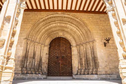Stone wall with arched door in Seville