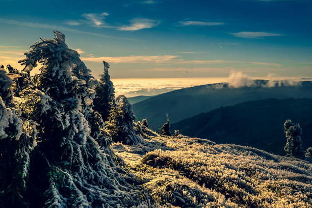 istock View from mountain range to the valley above fog and clouds 1366478596