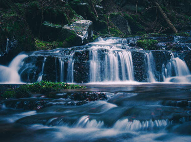 istock Wild brook with stones and waterfall in Jeseniky mountains 1366478653