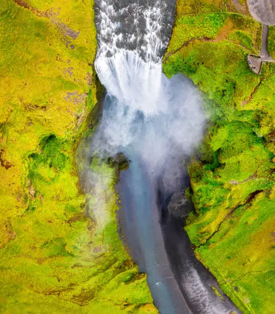 Photo of Iceland. Aerial view on the Skogafoss waterfall. Landscape in the Iceland from air. Famous place in Iceland. Landscape from drone.