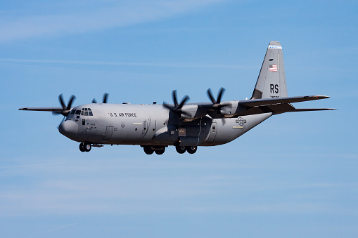 Ramstein, Germany - April 10, 2015: Military transport plane at air base. Air force flight operation. Aviation and aircraft. Air defense. Military industry. Fly and flying.