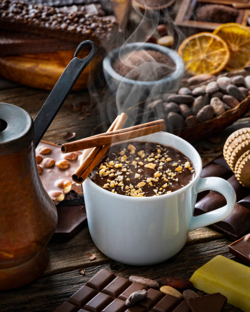Melted hot chocolate cup with vintage copper chocolate pot