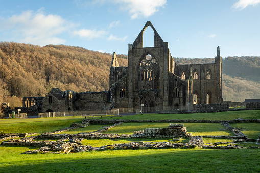 Editorial Tintern, UK - April 19, 2022: Tintern Abbey built on the Welsh side of the River Wye bordering Monmouthshire in Wales and Gloucestershire in England UK