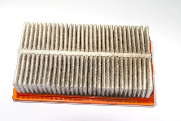 dirty air filter of a Nissan or Renault engine was replaced after the standard operating life to ensure the operation of the engine, selective focus