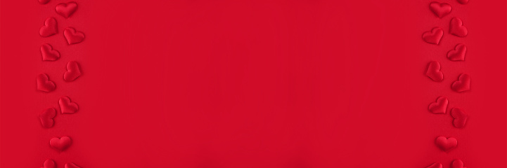 Festive St. Valentines banner with red hearts on red background with copy space. St.Valentines day background for your project. Selective focus