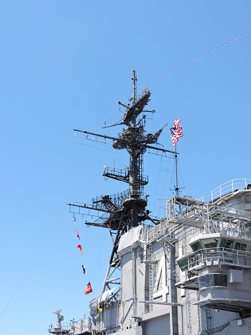 Low angle view of the antenna tower on the deck of the USS Midway aircraft Carrier in San Diego, California.  August 17, 2017