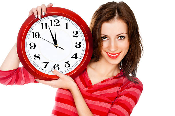 istock woman with the clock isolated in white 136648885